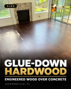 Completed wood flooring beside a fireplace in a Nunes 4 Flooring glue-down project in Fernandina Beach