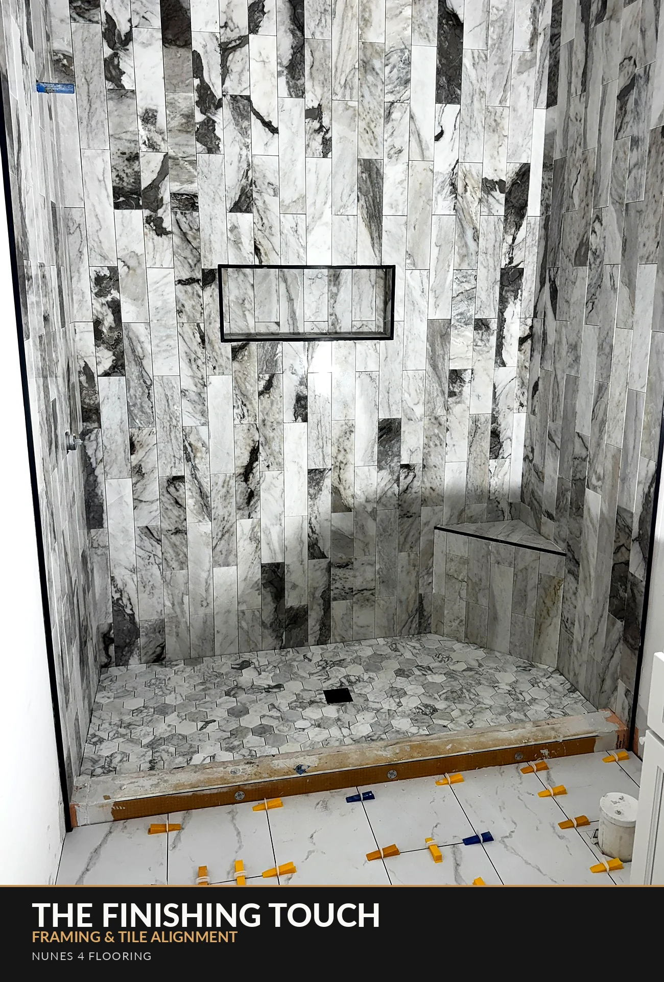 Nunes 4 Flooring marble-look shower tile and black-trimmed niche
